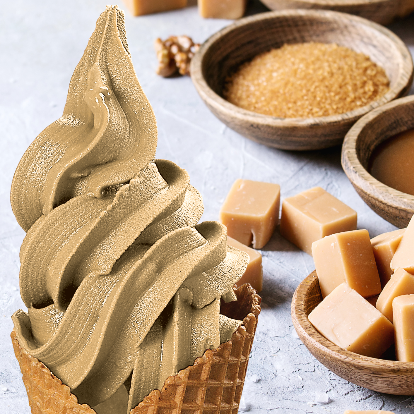 Caramel flavour sachet being mixed into soft serve base