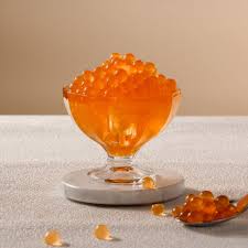 Peach popping boba used in a dessert bowl