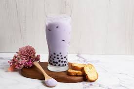 Taro flavour powder mixed into a purple taro milk tea